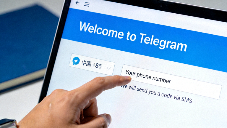 Telegram电脑版首次启动的登录界面截图，显示输入手机号码的国家选择和输入框