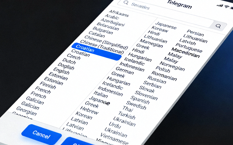 Telegram语言选择窗口截图，显示长长的语言列表，其中Chinese (Simplified)中文简体选项被高亮选中